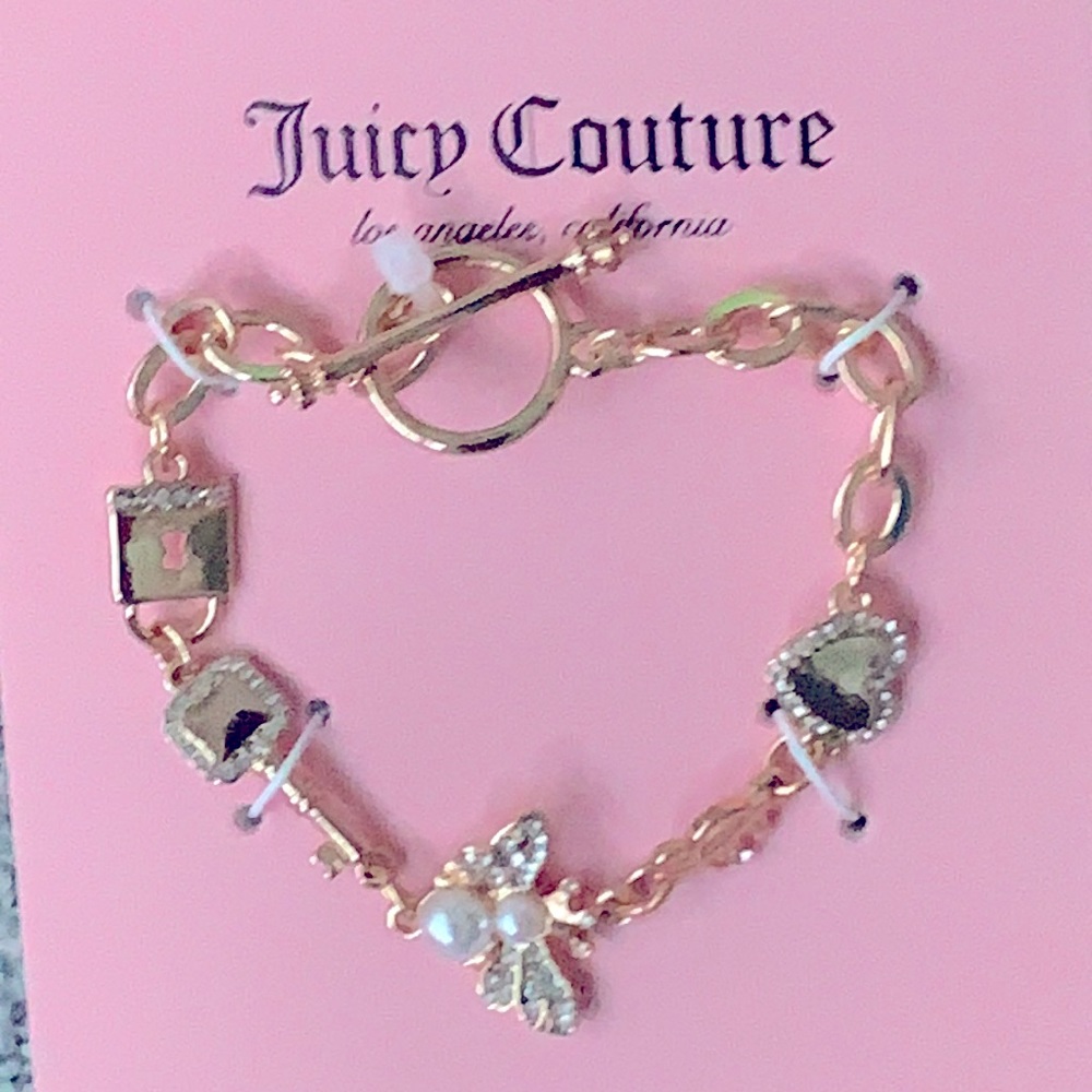 Juicy Couture- Gold tone Butterfly, heart, lock & key bracelet with rhinestones